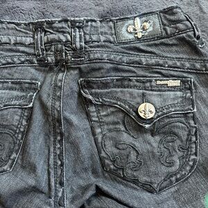 Laguna Beach black denim fleur de lis boot cut jeans